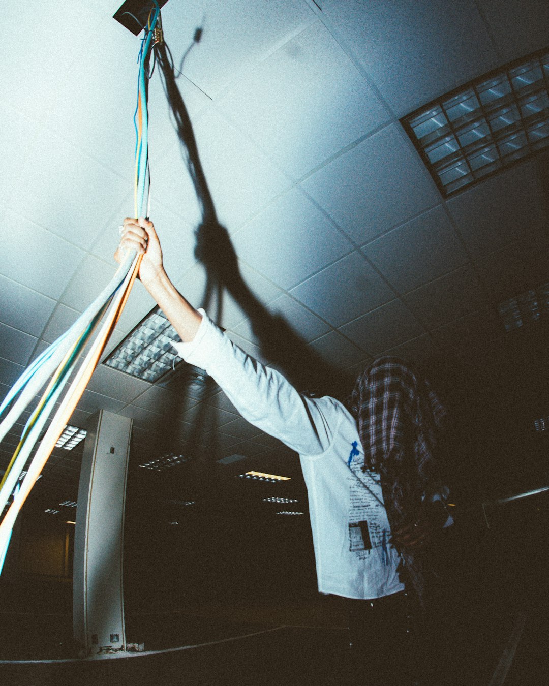 a person holding a bunch of wires in the air