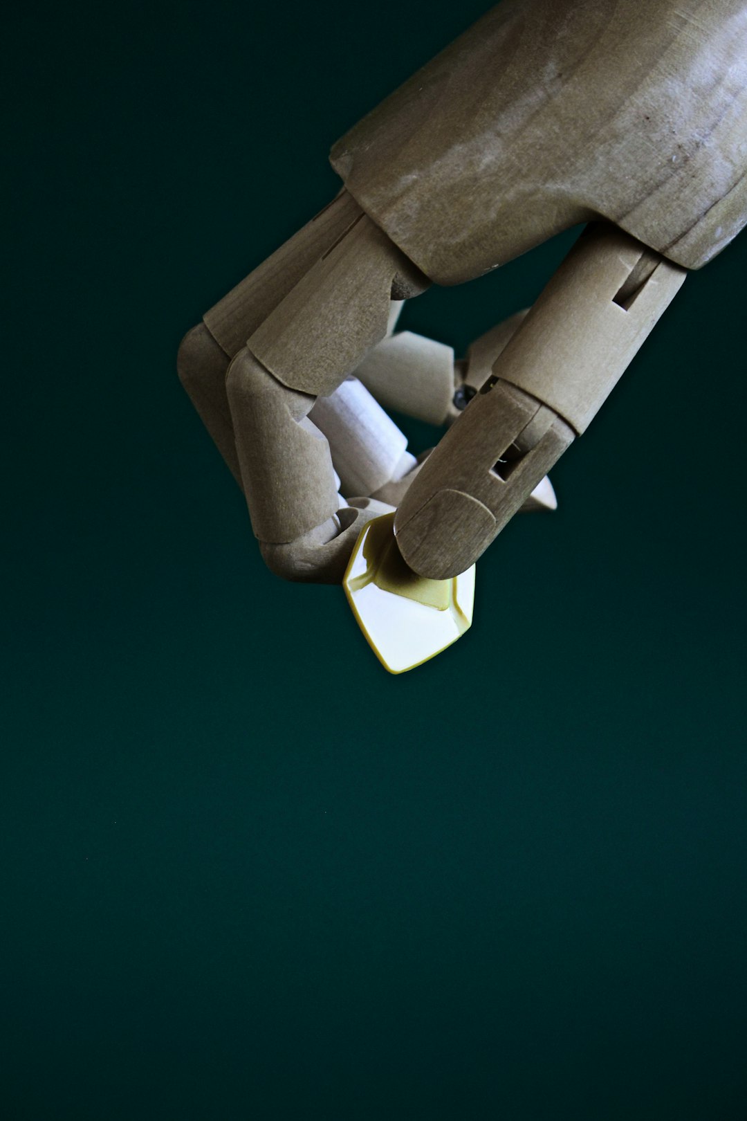 a close up of a robot holding a piece of paper