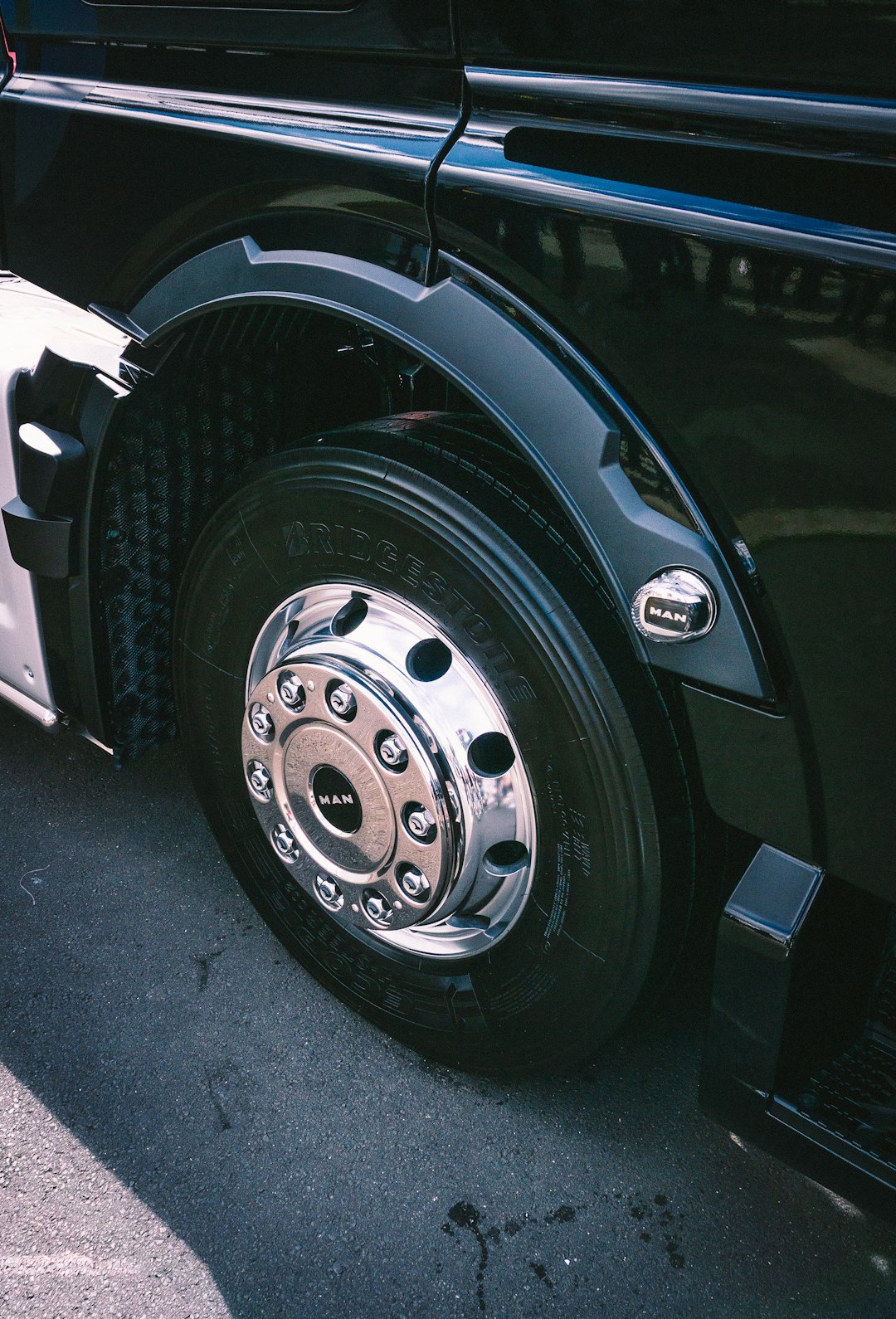 A close up of a black truck tire