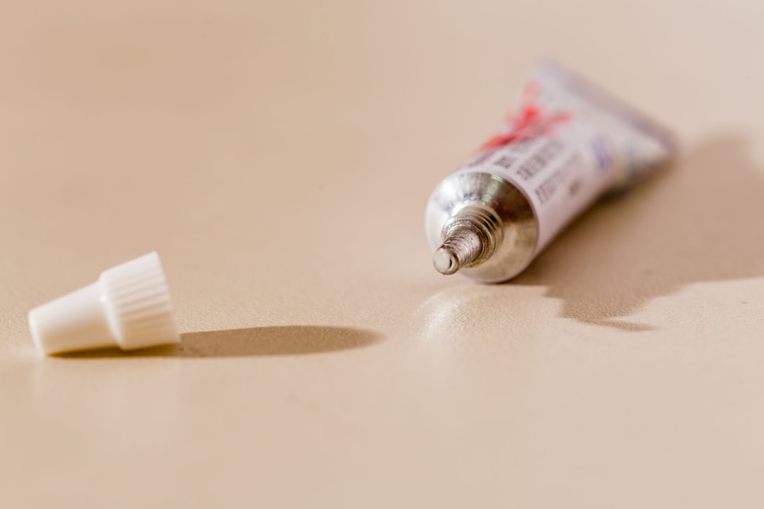 white tube bottle on white table