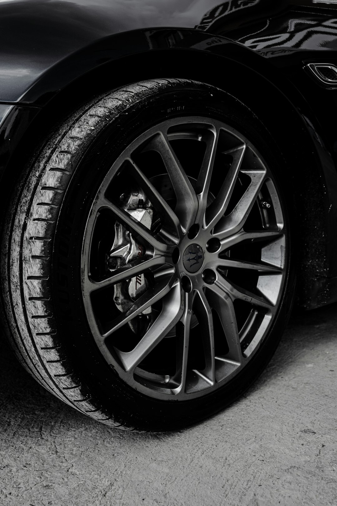 Close-up of a black car wheel and tire