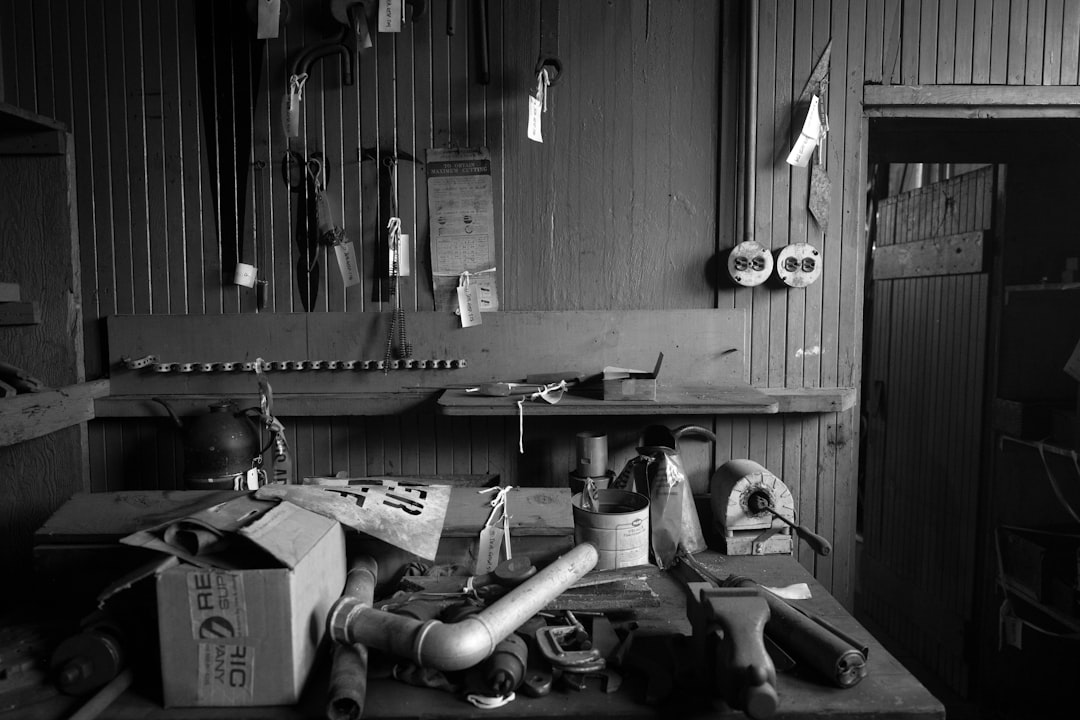 A cluttered workbench with tools and supplies.