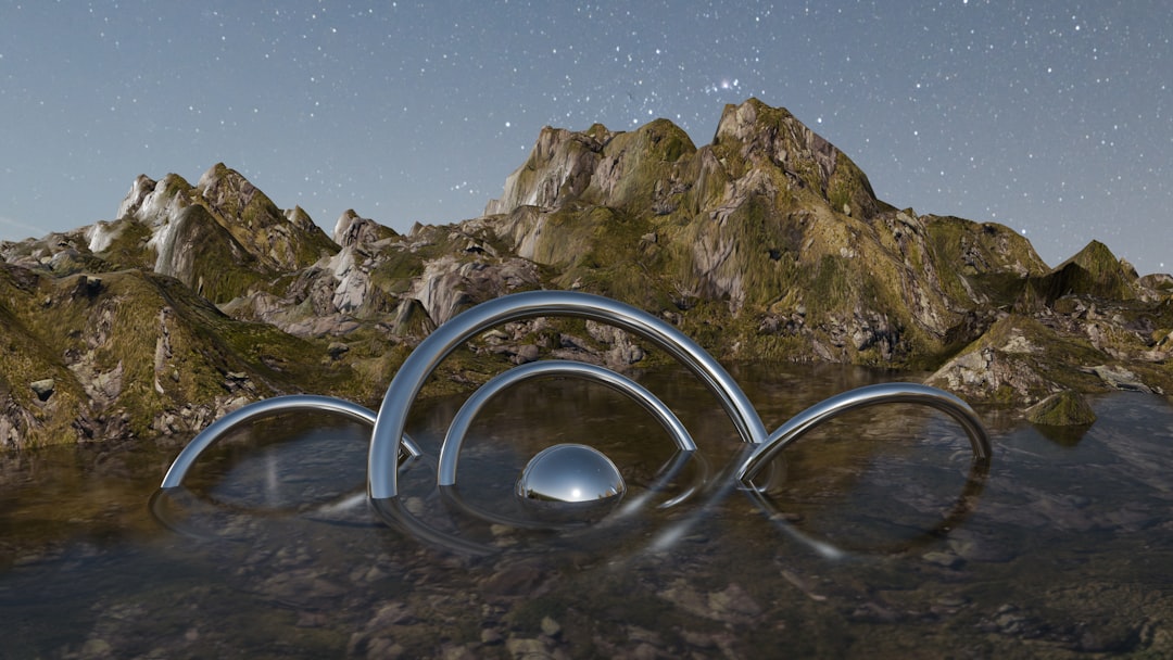 Metallic arches rise from water against mountains.