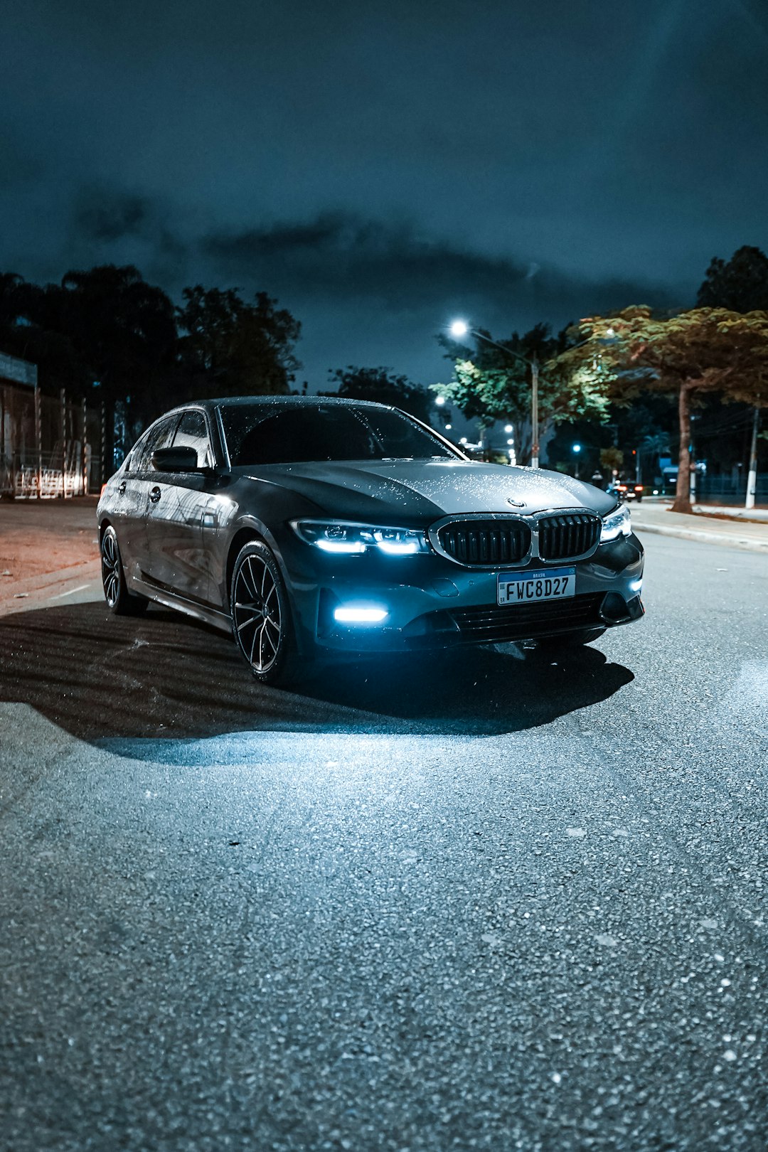 a car parked on a street at night