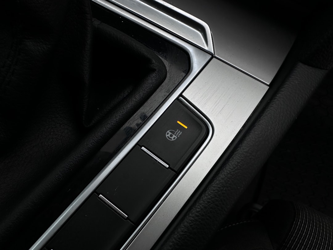 Close-up of a car's electronic parking brake button.
