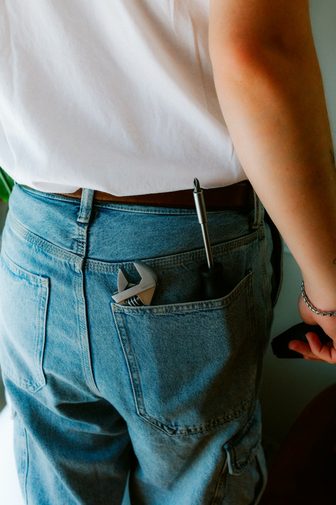 Adjustable wrench and screwdriver in back pocket