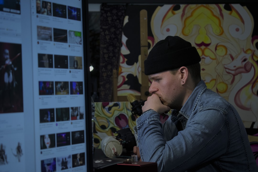 Man stares intently at a computer screen