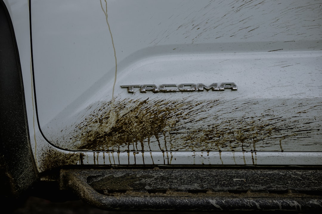 White vehicle covered in mud splatters