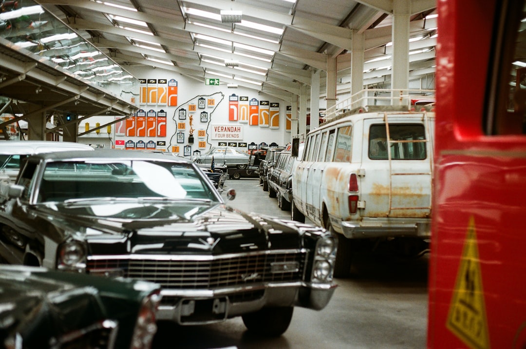 Classic cars lined up inside a museum hall