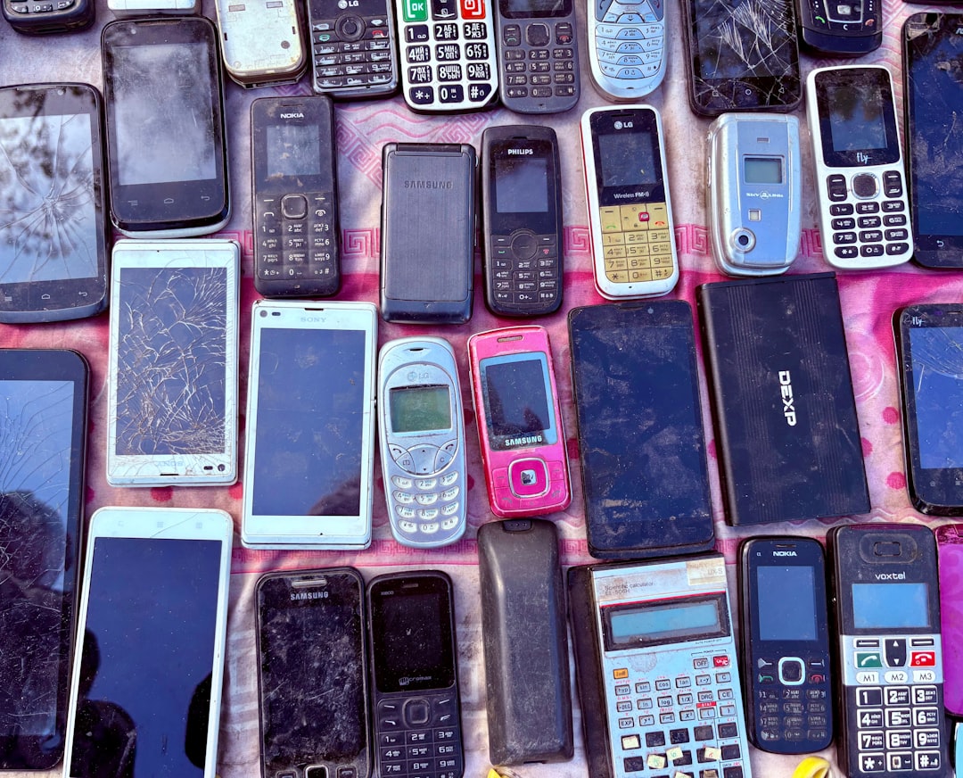 A collection of various old mobile phones and devices