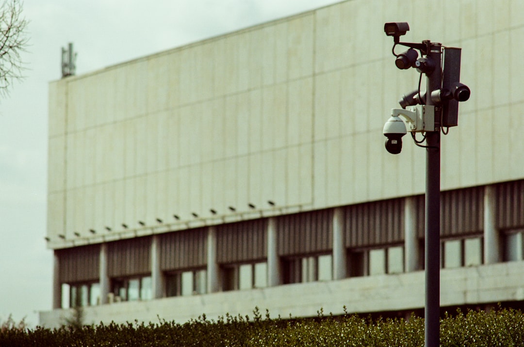 Security cameras mounted on a pole outside building