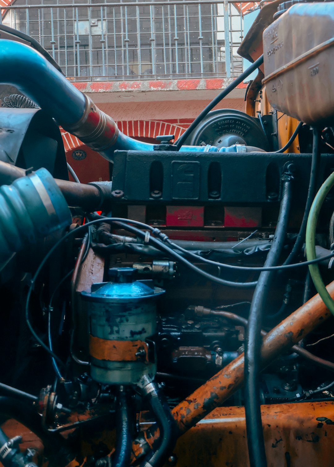 Close-up of a complex truck engine with pipes and wires