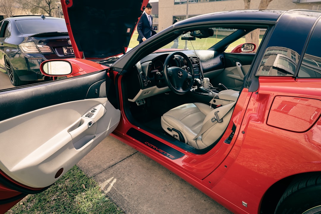 Red sports car interior with open doors