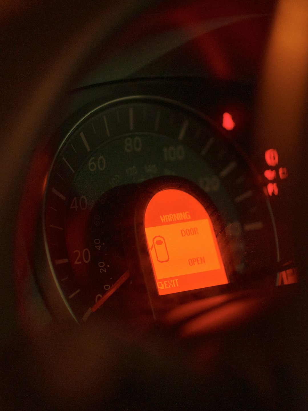 Car dashboard with illuminated warning lights
